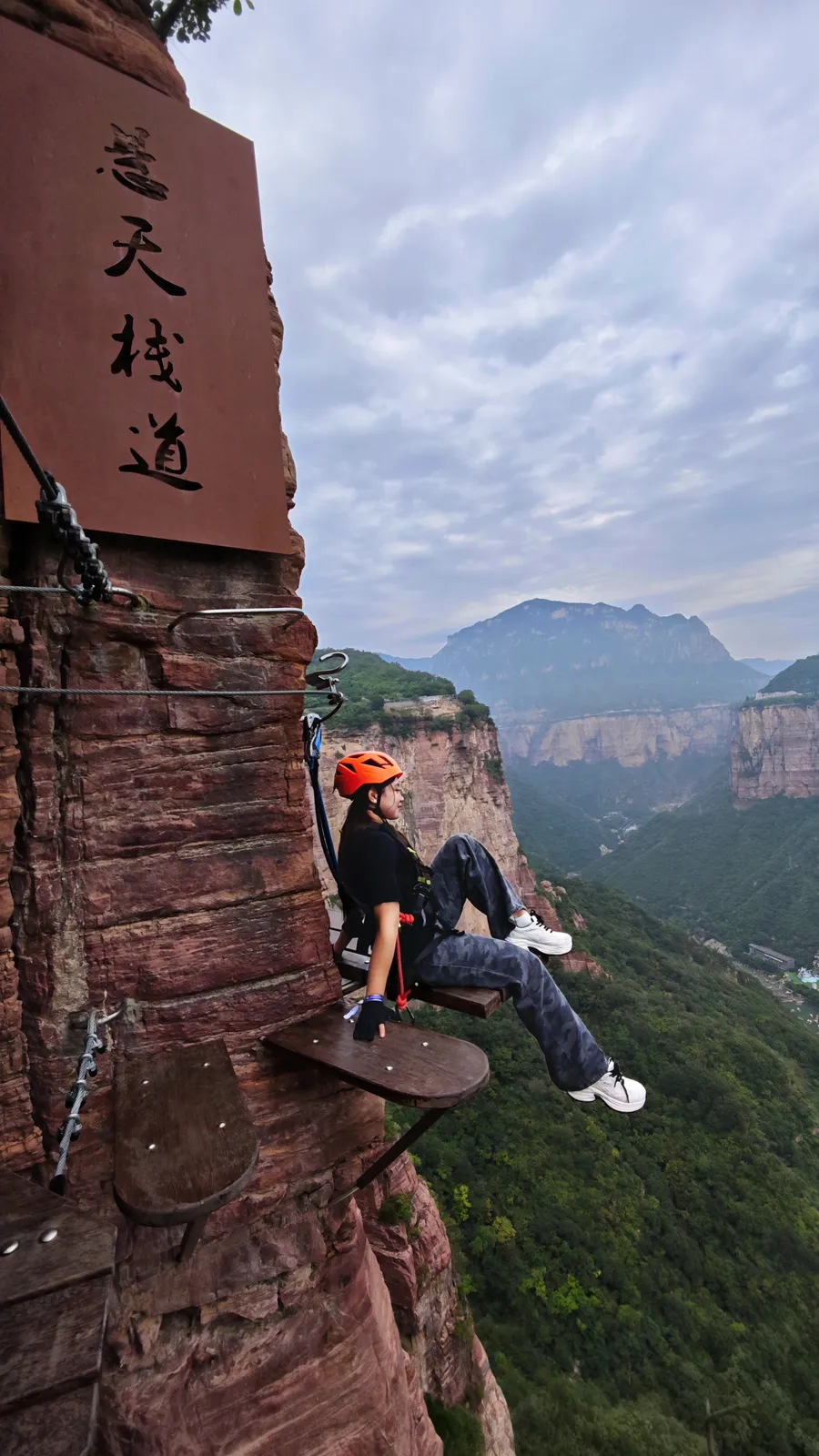 Rest ledge on Baoquan Via Ferrata where climbers pause on the cliff face