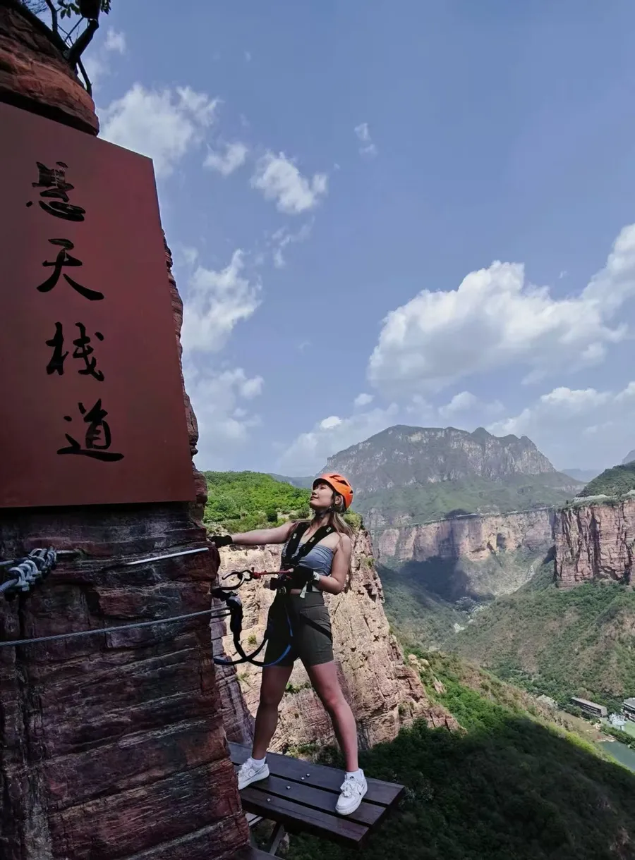 Baoquan Via Ferrata start platform with full harness and route entry view